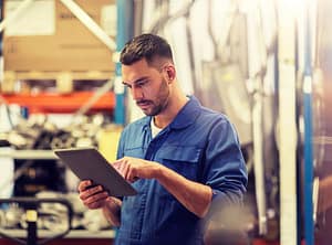 Man Checking Used Car Part inventory