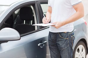 Car Dismantler Looking at a car